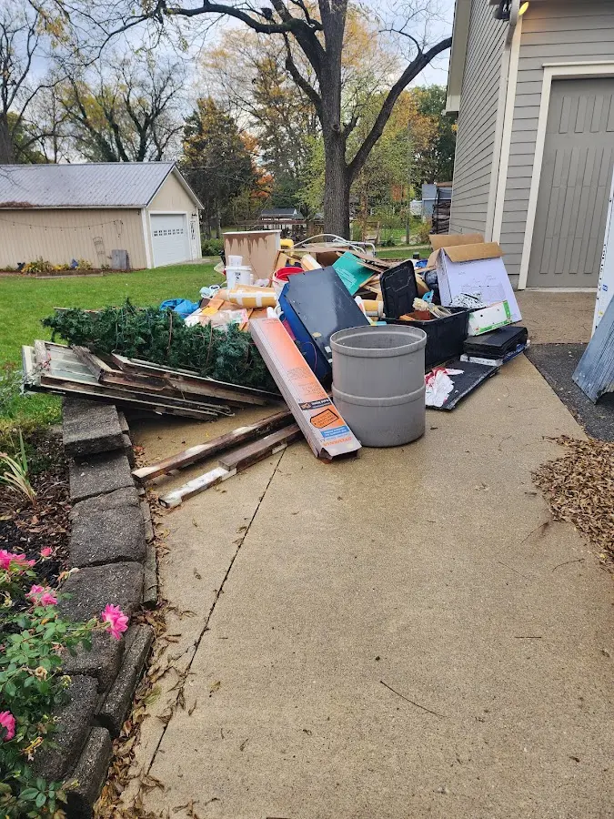 Dumpster being loaded with debris for Commercial Dumpster Rental in Carefree
